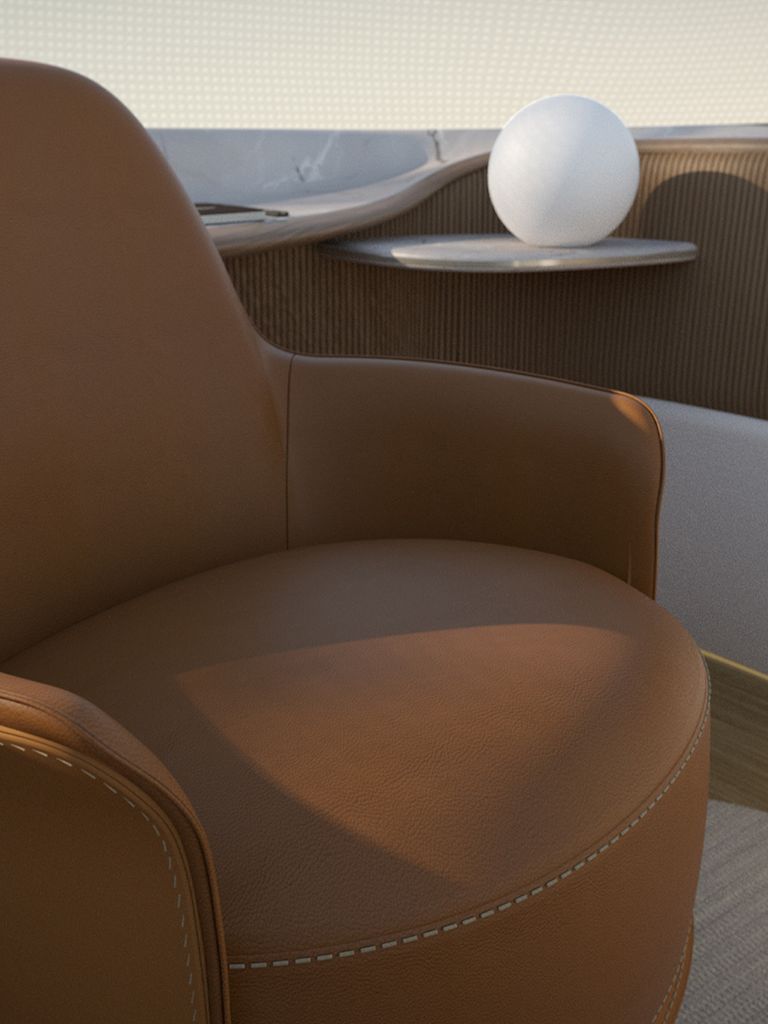 The interior design by Poliform shows a brown armchair.