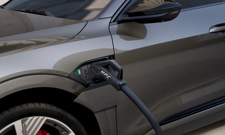 A high-power charging cable connected to the Audi Q8 e-tron{ft_q8-e-tron}.