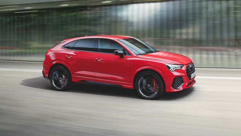 dynamic side view of the RS Q3 Sportback in tango red